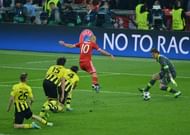 Bayern Munich's Arjen Robben (2nd R) scores past Borussia Dortmund's Roman Weidenfeller (R) in London on May 25, 2013
